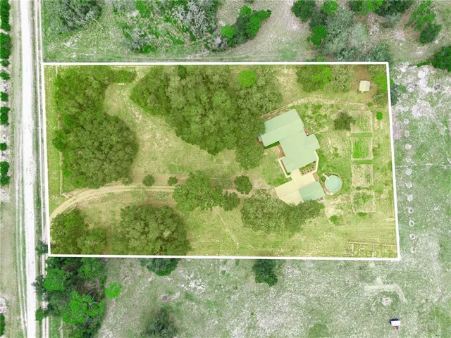 a view of a house with a big yard