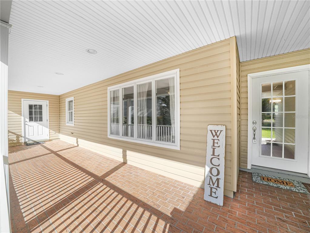 3963 Mammoth Grove Road Lake Wales, FL 33898 - Photo 7 of 42 a front view of a house with a lounge chair