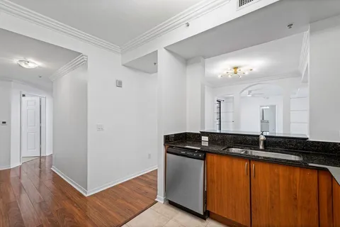 a view of a sink and cabinets