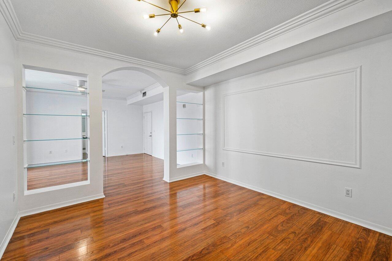 233 South Federal Highway, Unit 408 Boca Raton, FL 33432 - Photo 14 of 48 an empty room with wooden floor and closet