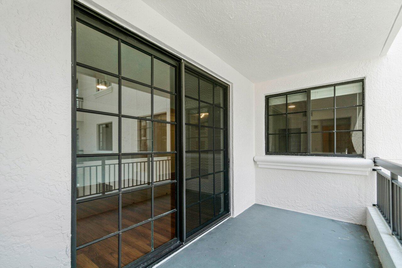 233 South Federal Highway, Unit 408 Boca Raton, FL 33432 - Photo 25 of 48 a view of staircase with white walls and windows