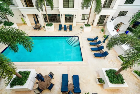 a view of swimming pool with outdoor seating