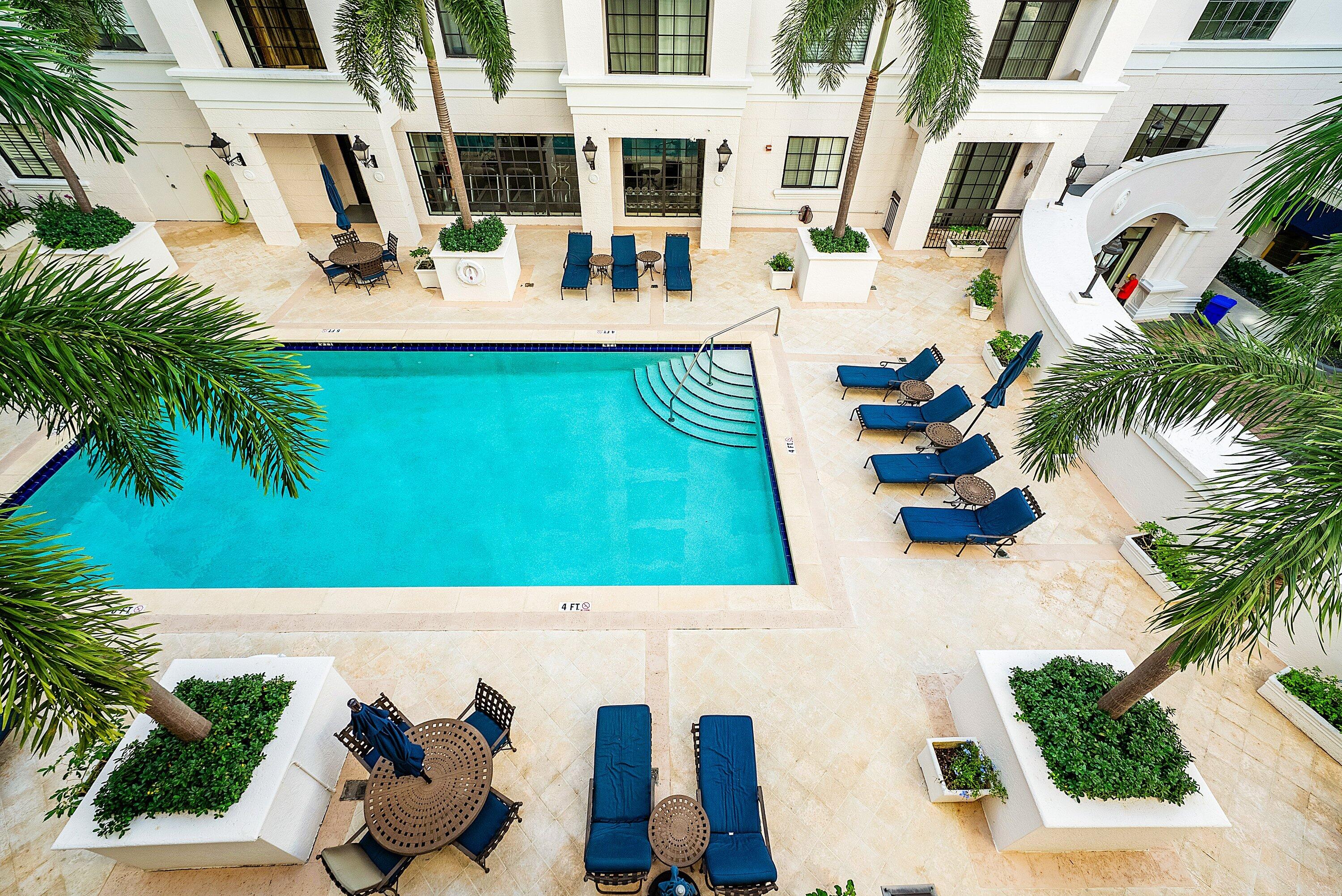 233 South Federal Highway, Unit 408 Boca Raton, FL 33432 - Photo 32 of 48 a view of swimming pool with outdoor seating
