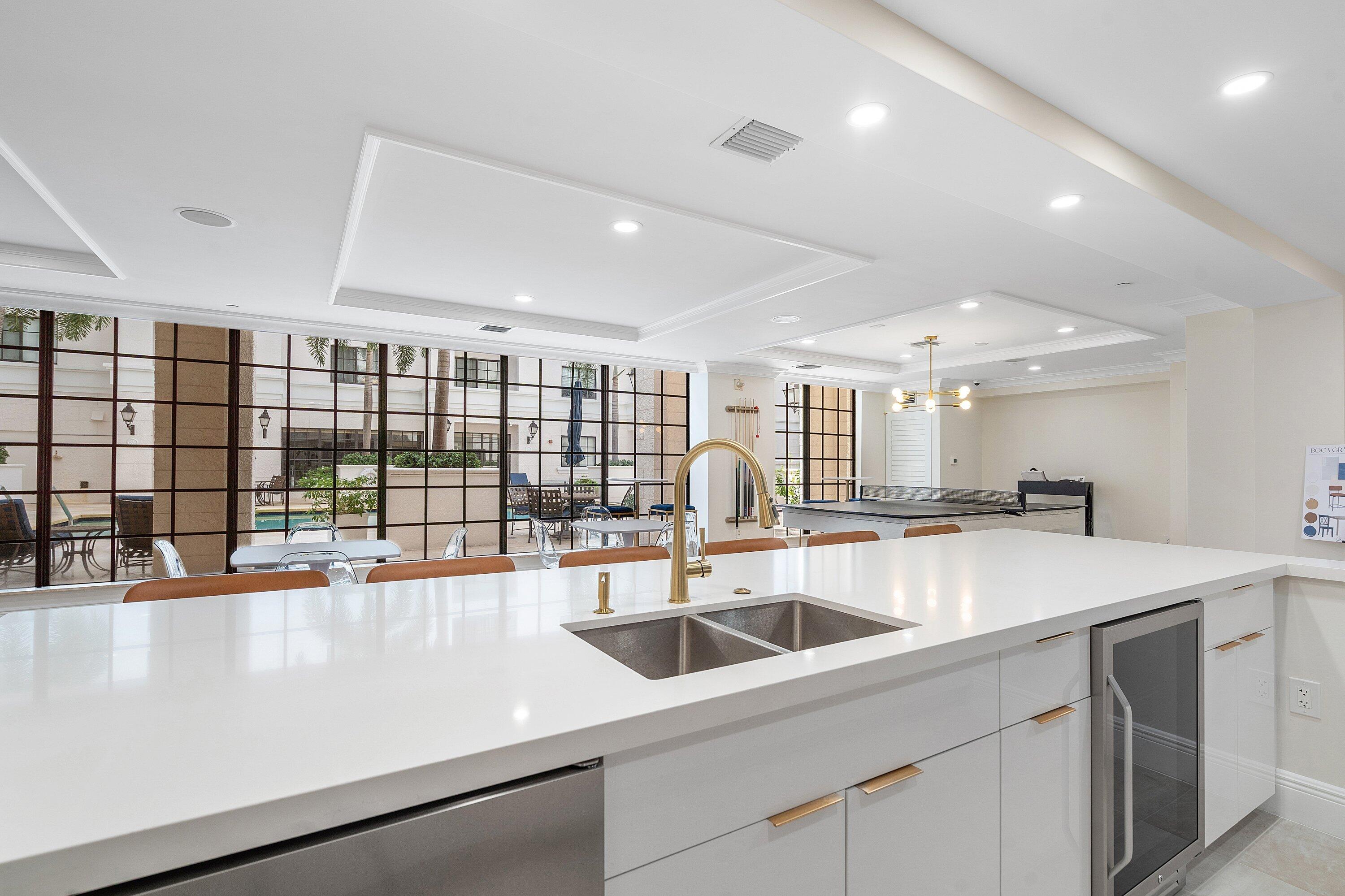 233 South Federal Highway, Unit 408 Boca Raton, FL 33432 - Photo 39 of 48 a kitchen with a sink and large window