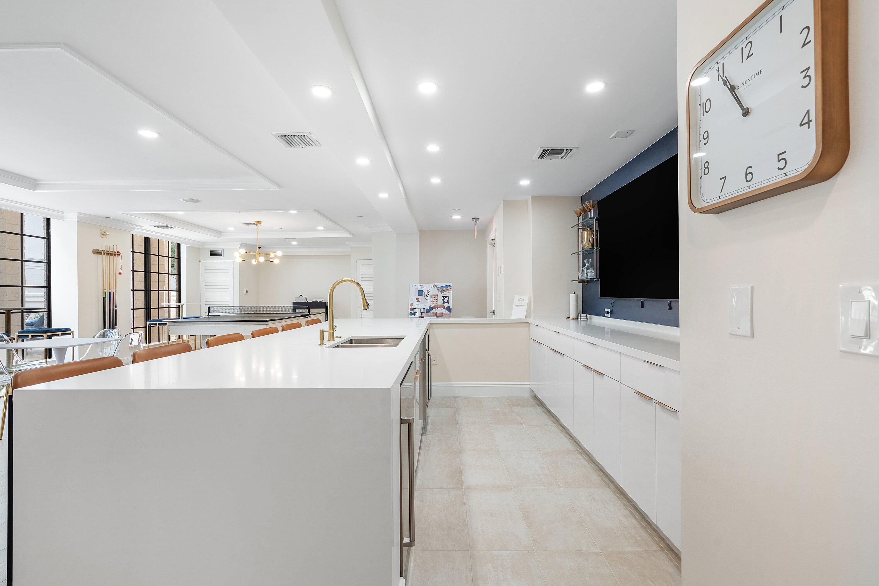 233 South Federal Highway, Unit 408 Boca Raton, FL 33432 - Photo 44 of 48 a large white kitchen with a large window