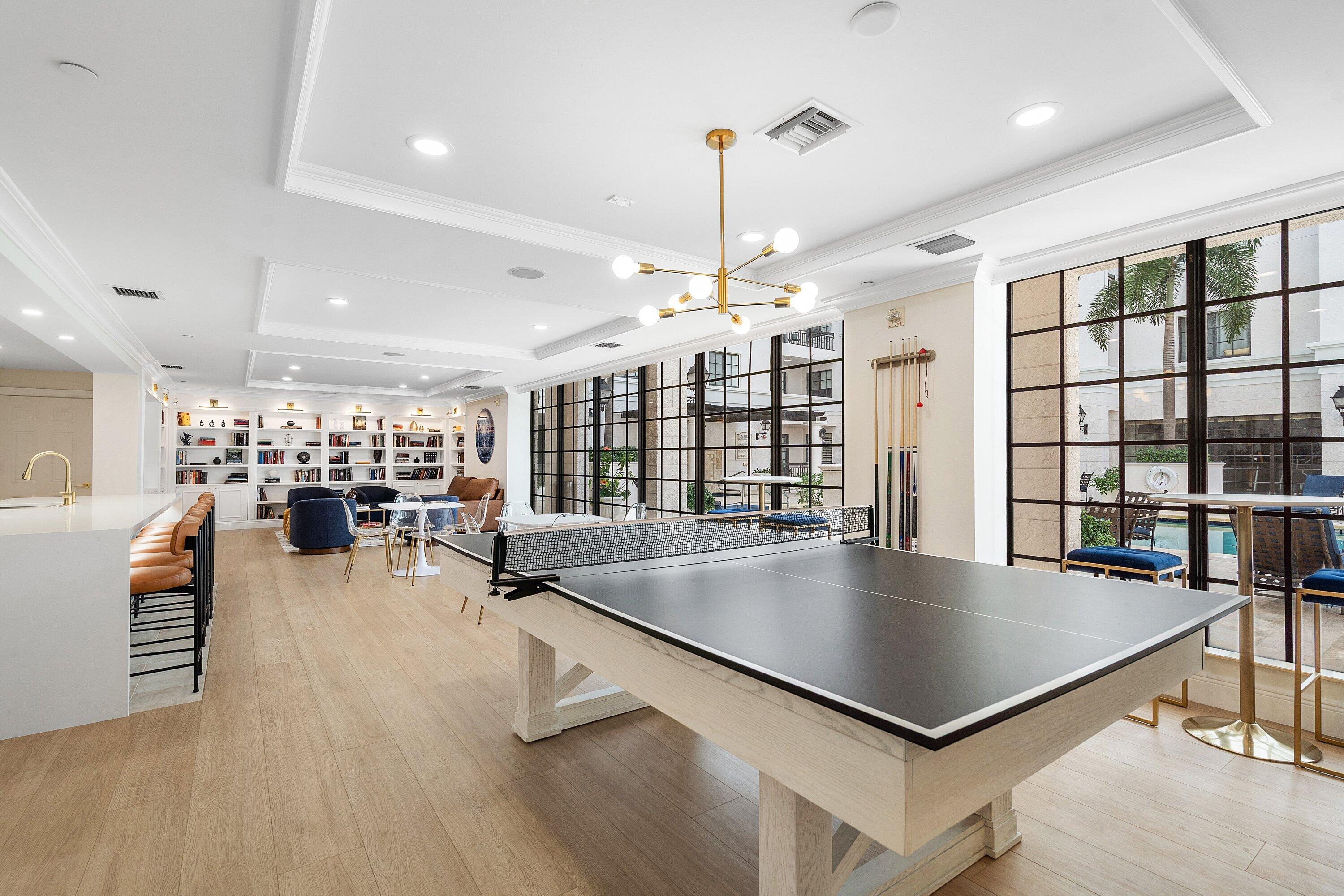 233 South Federal Highway, Unit 408 Boca Raton, FL 33432 - Photo 48 of 48 a room with lots of table chairs wooden floor and a potted plant