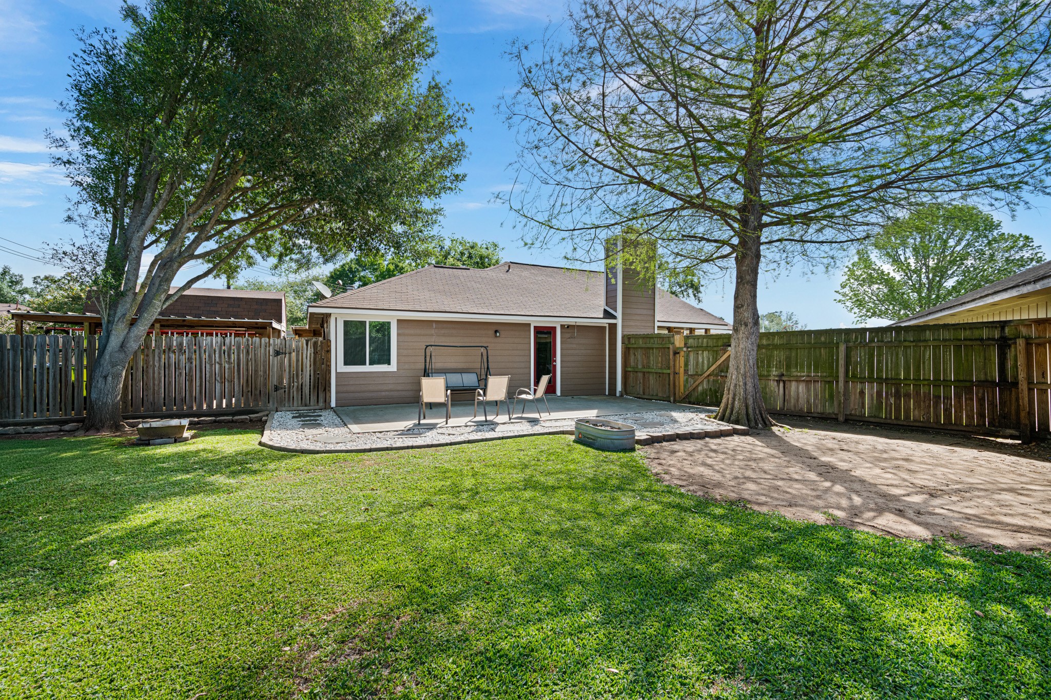 1804 Spruce Drive Rosenberg, TX 77471 - Photo 4 of 29 a front view of a house with yard patio and wooden fence
