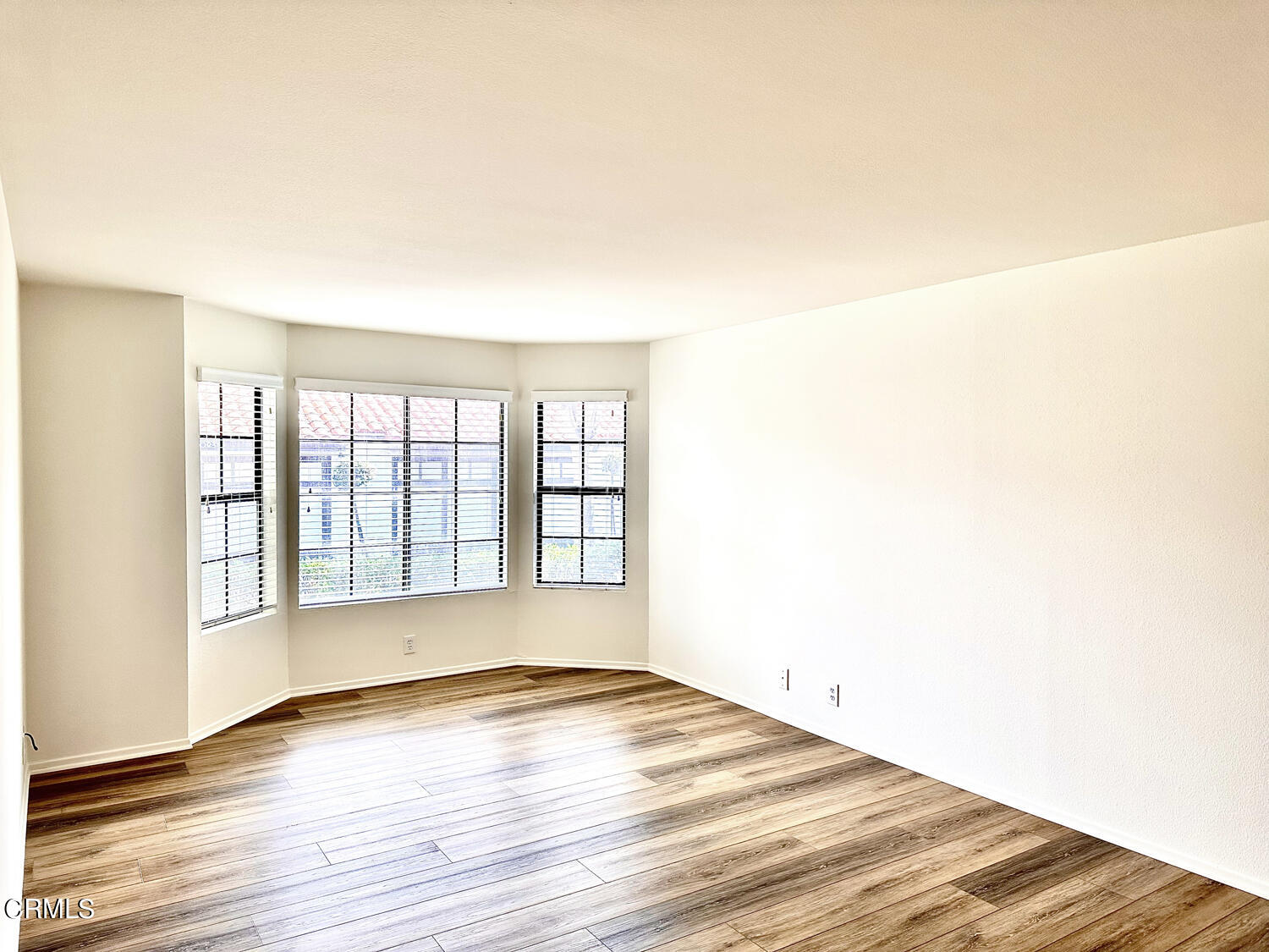 2025 Majorca Drive Oxnard, CA 93035 - Photo 11 of 28 a view of an empty room with wooden floor and a window
