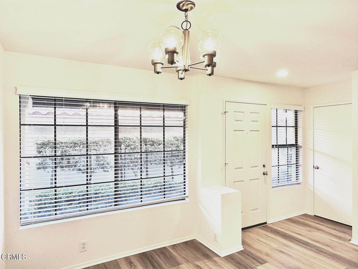 2025 Majorca Drive Oxnard, CA 93035 - Photo 5 of 28 a view of a livingroom with wooden floor and a ceiling fan