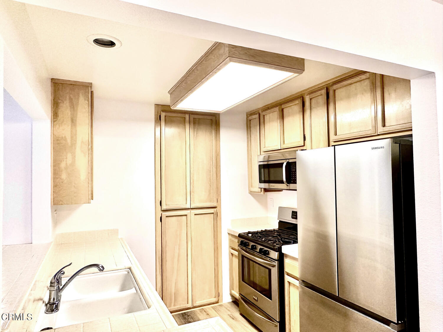 2025 Majorca Drive Oxnard, CA 93035 - Photo 8 of 28 a kitchen with a refrigerator and a sink