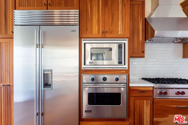 a kitchen with a stove and a microwave