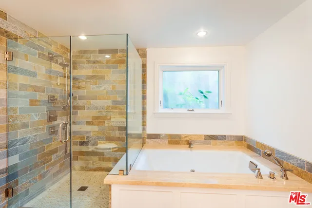 a view of a bathroom with a sink and mirror