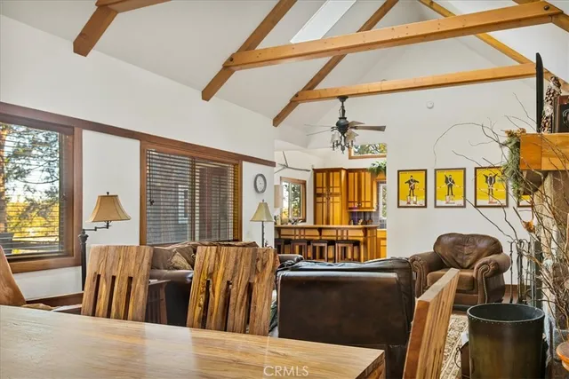 a kitchen with a large window and cabinets