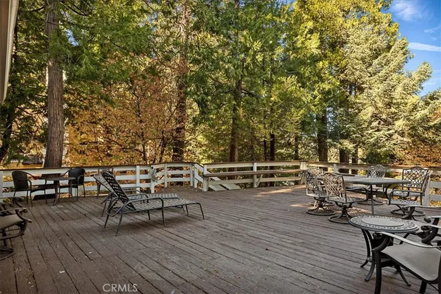 a view of a house with a tree in front of it