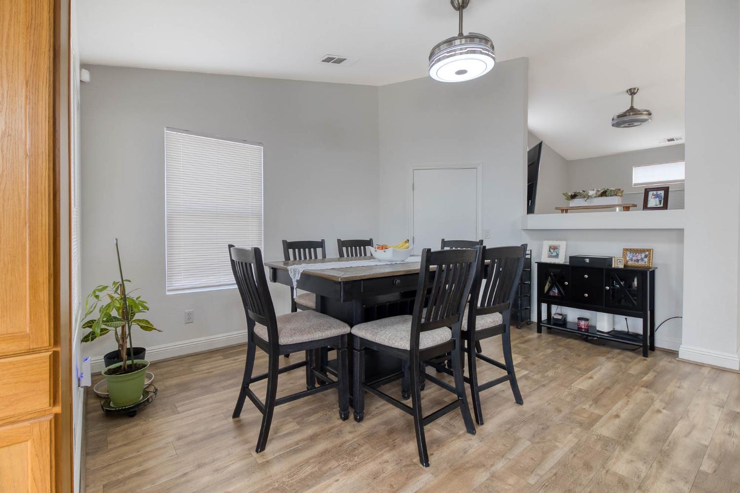 2913 Soquel Avenue Atwater, CA 95301 - Photo 12 of 29 a view of a dining room with furniture and wooden floor