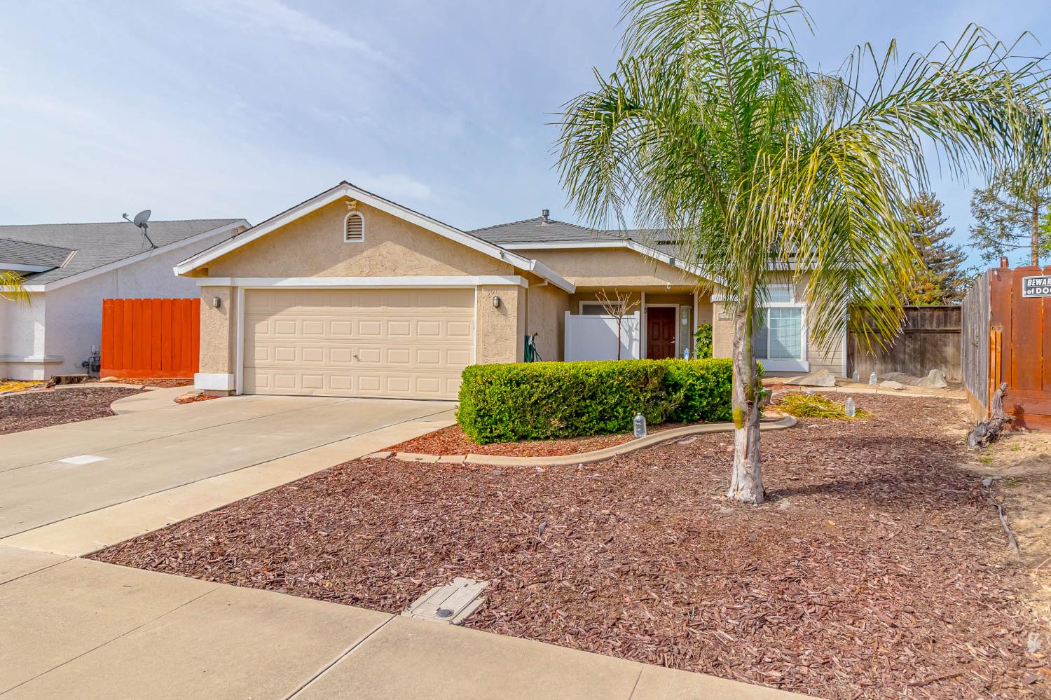 2913 Soquel Avenue Atwater, CA 95301 - Photo 2 of 29 a front view of a house with a yard and potted plants