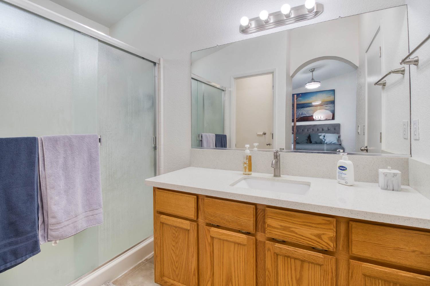 2913 Soquel Avenue Atwater, CA 95301 - Photo 23 of 29 a bathroom with a sink and a mirror