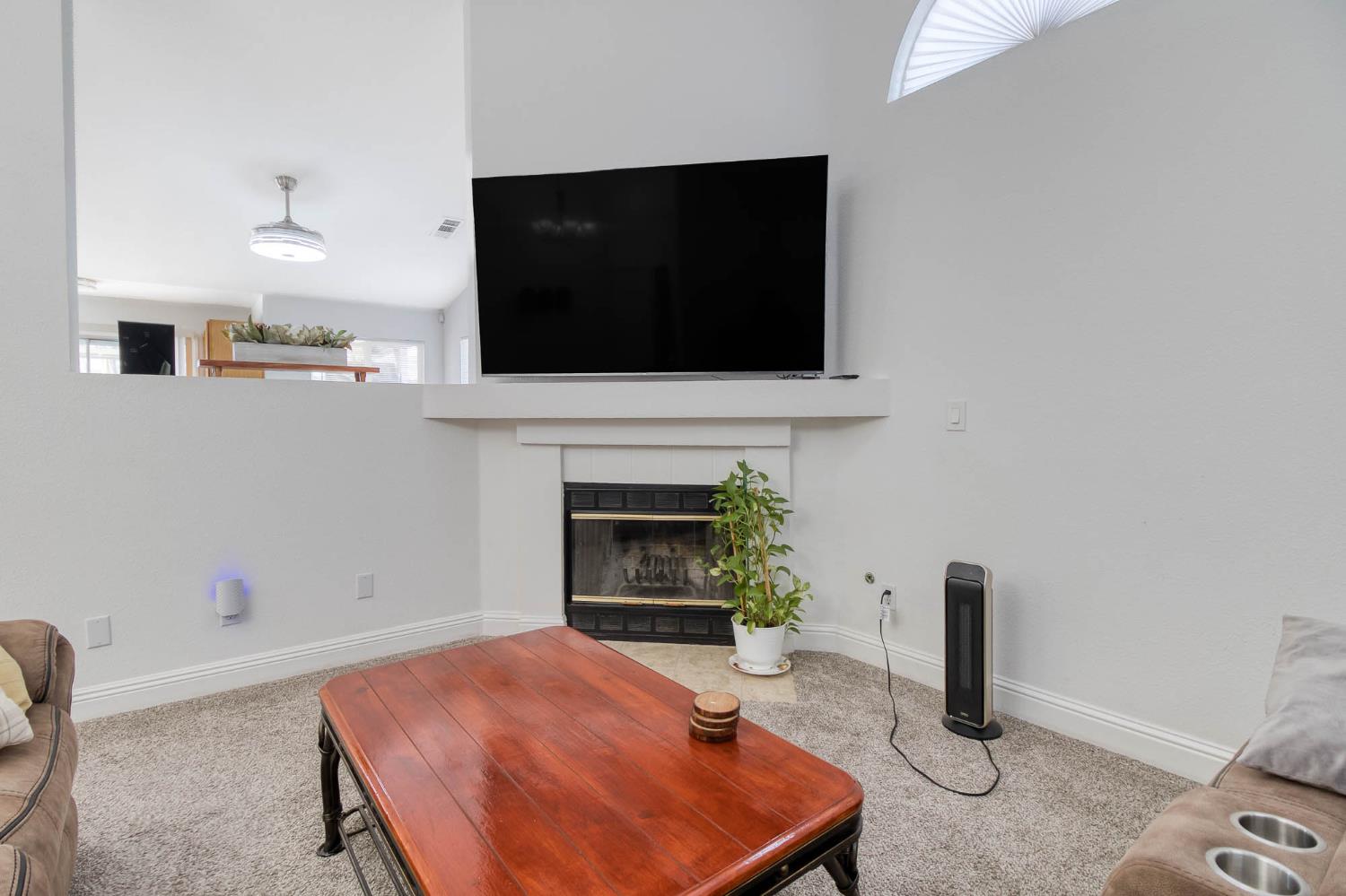 2913 Soquel Avenue Atwater, CA 95301 - Photo 8 of 29 a living room with furniture and a fireplace