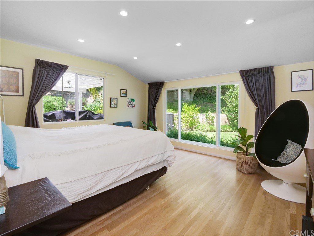 5063 Foxpoint Lane Rolling Hills Estates, CA 90274 - Photo 14 of 35 a bed room with a bed mirror and a large window