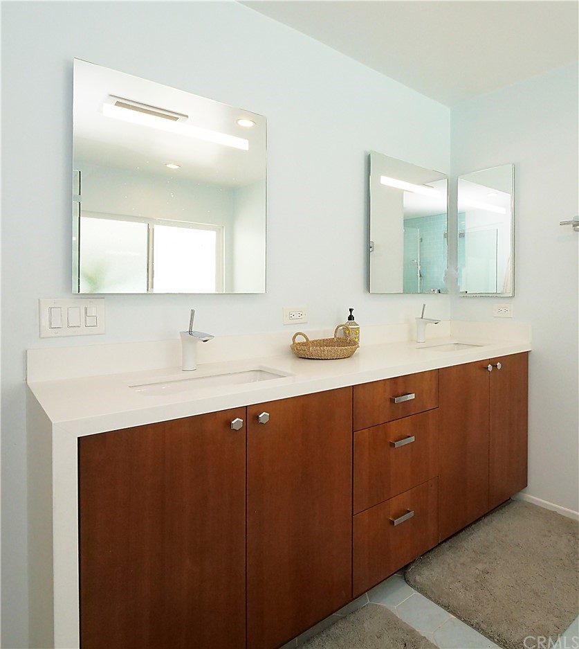 5063 Foxpoint Lane Rolling Hills Estates, CA 90274 - Photo 16 of 35 a bathroom with a double vanity sink and mirror