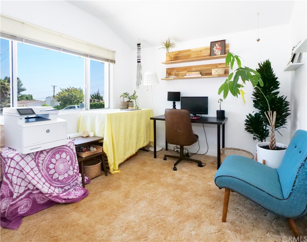 5063 Foxpoint Lane Rolling Hills Estates, CA 90274 - Photo 21 of 35 a view of a workspace with furniture and a potted plant