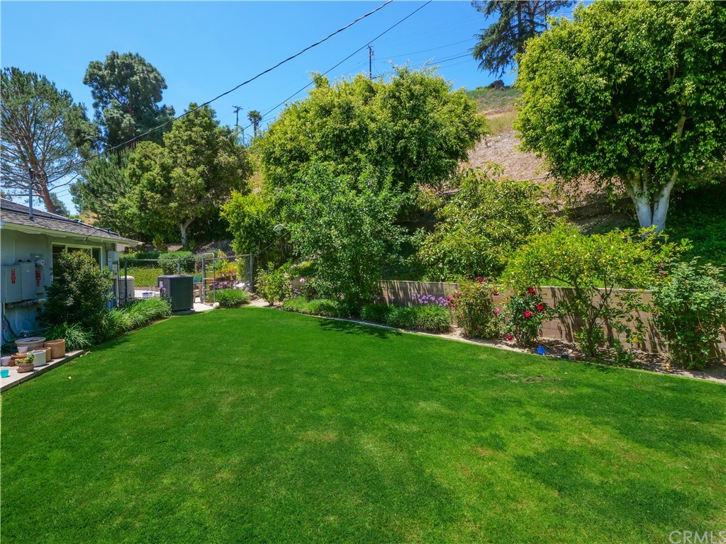 5063 Foxpoint Lane Rolling Hills Estates, CA 90274 - Photo 35 of 35 a view of a backyard with potted plants and large trees