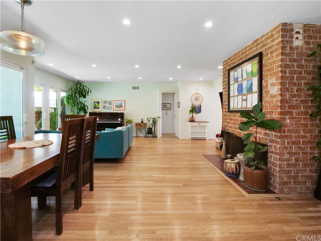 5063 Foxpoint Lane Rolling Hills Estates, CA 90274 - Photo 6 of 35 a living room with furniture a flat screen tv and a fireplace