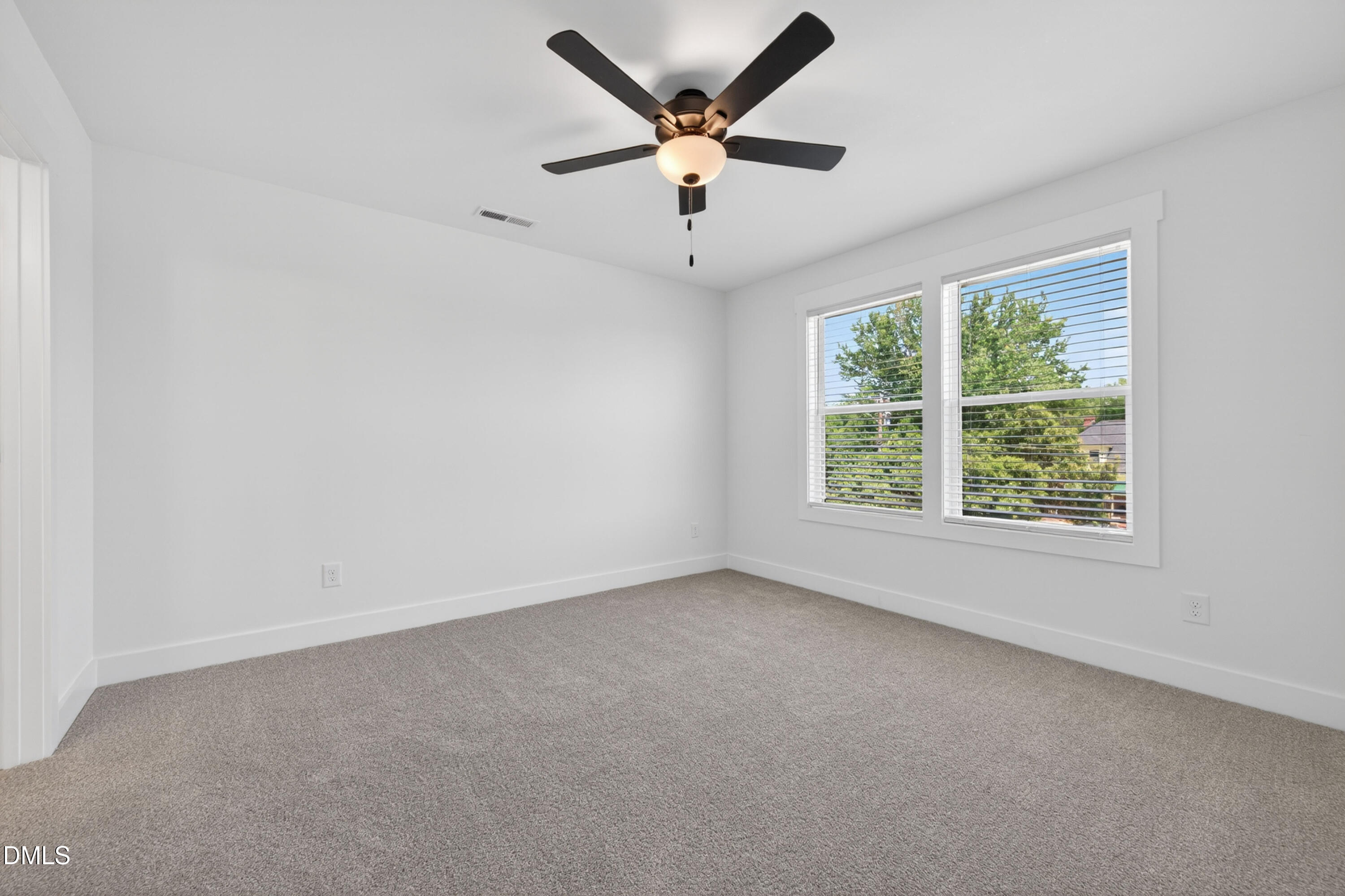 1182 Hurdle Mills Road Roxboro, NC 27573 - Photo 25 of 45 an empty room with a window and a fan