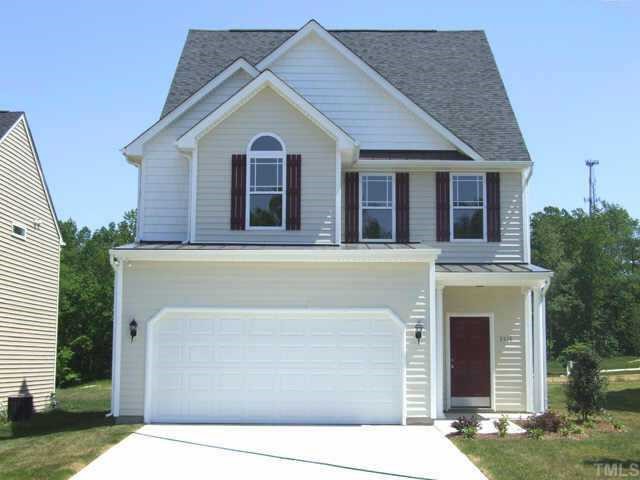3915 Cane Garden Drive Raleigh, NC 27610 - Photo 1 of 8 a front view of a house with a garden