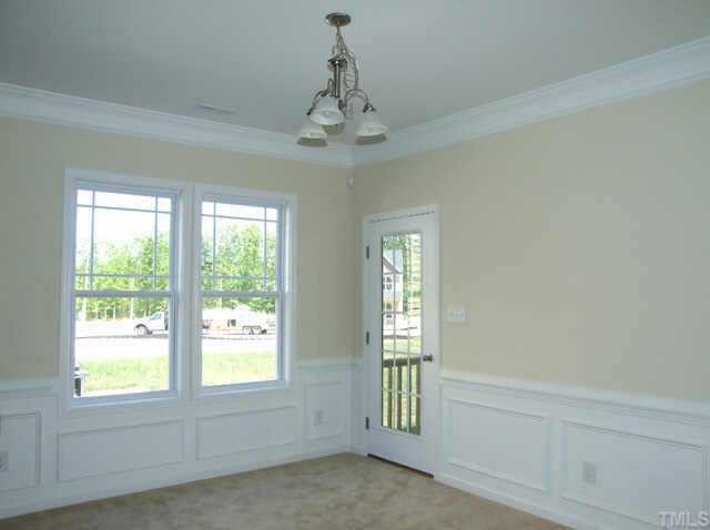 3915 Cane Garden Drive Raleigh, NC 27610 - Photo 5 of 8 a view of an empty room with a window