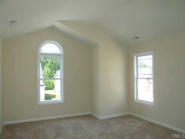 3915 Cane Garden Drive Raleigh, NC 27610 - Photo 8 of 8 an empty room with a window