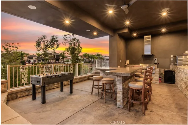 a bathroom with a toilet sink vanity and mirror