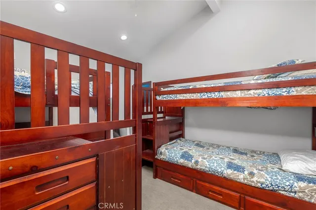 a view of a dining room with furniture a chandelier and wooden floor
