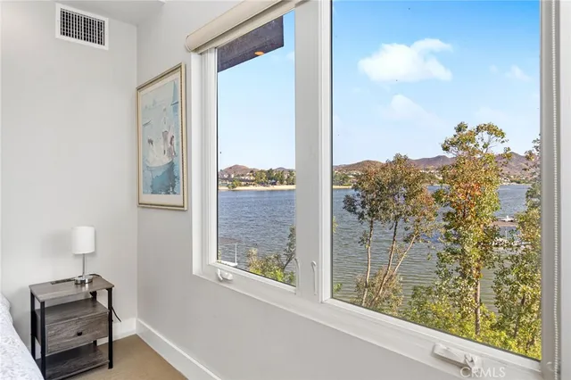 a view of a patio with table and chairs