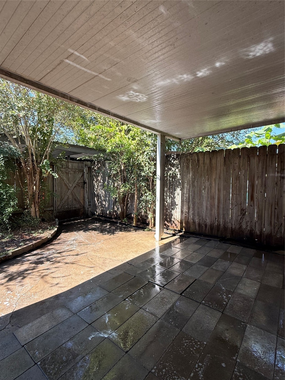 8140 Fondren Road, Unit 8140 Houston, TX 77074 - Photo 15 of 28 two-story townhouse with a mix of brick and siding exterior. It features a small front yard with a concrete path leading to the entrance. Large windows on the second floor and a neatly landscaped area enhance its curb appeal.