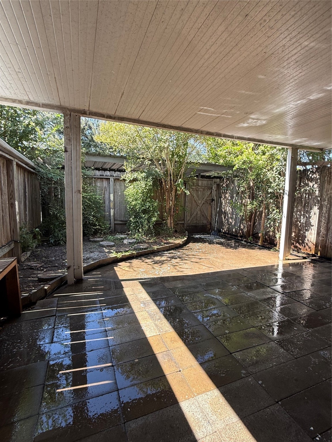 8140 Fondren Road, Unit 8140 Houston, TX 77074 - Photo 16 of 28 two-story townhouse with a mix of brick and siding exterior. It features a small front yard with a concrete path leading to the entrance. Large windows on the second floor and a neatly landscaped area enhance its curb appeal.
