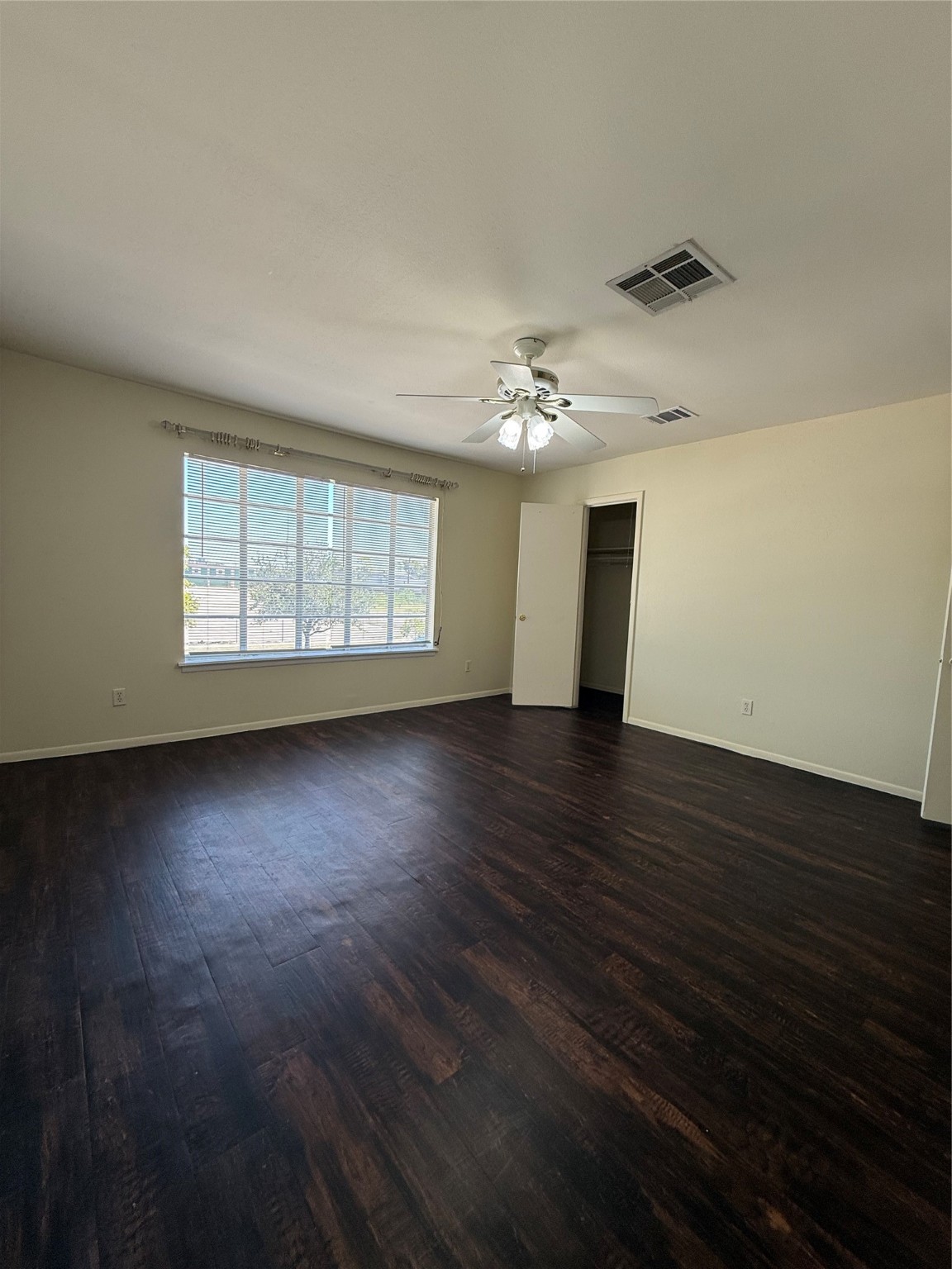8140 Fondren Road, Unit 8140 Houston, TX 77074 - Photo 20 of 28 a view of an empty room with wooden floor and a window