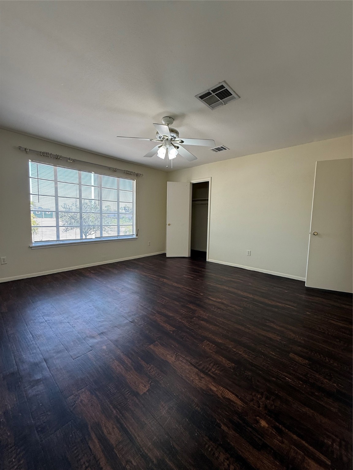 8140 Fondren Road, Unit 8140 Houston, TX 77074 - Photo 21 of 28 two-story townhouse with a mix of brick and siding exterior. It features a small front yard with a concrete path leading to the entrance. Large windows on the second floor and a neatly landscaped area enhance its curb appeal.