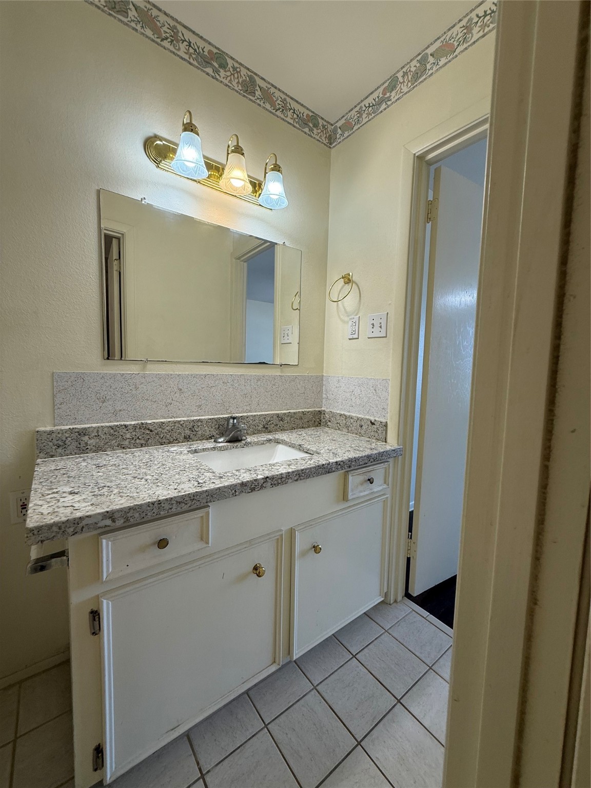 8140 Fondren Road, Unit 8140 Houston, TX 77074 - Photo 22 of 28 two-story townhouse with a mix of brick and siding exterior. It features a small front yard with a concrete path leading to the entrance. Large windows on the second floor and a neatly landscaped area enhance its curb appeal.