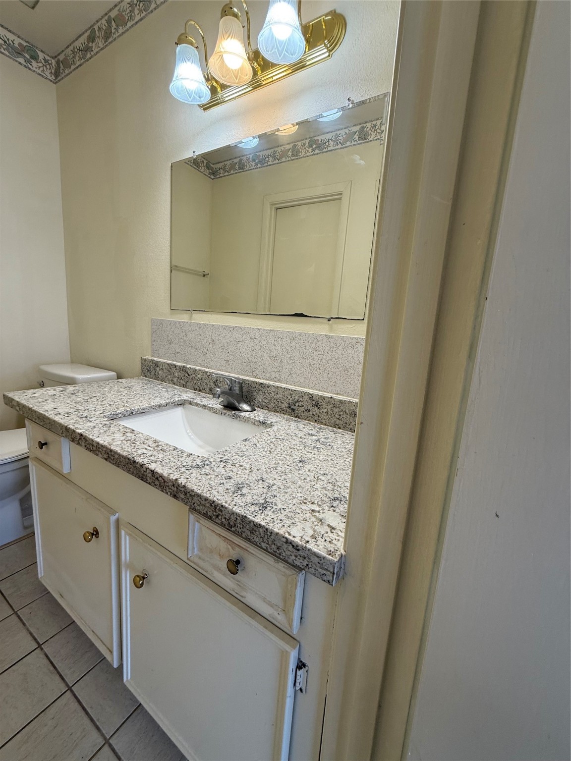 8140 Fondren Road, Unit 8140 Houston, TX 77074 - Photo 23 of 28 two-story townhouse with a mix of brick and siding exterior. It features a small front yard with a concrete path leading to the entrance. Large windows on the second floor and a neatly landscaped area enhance its curb appeal.