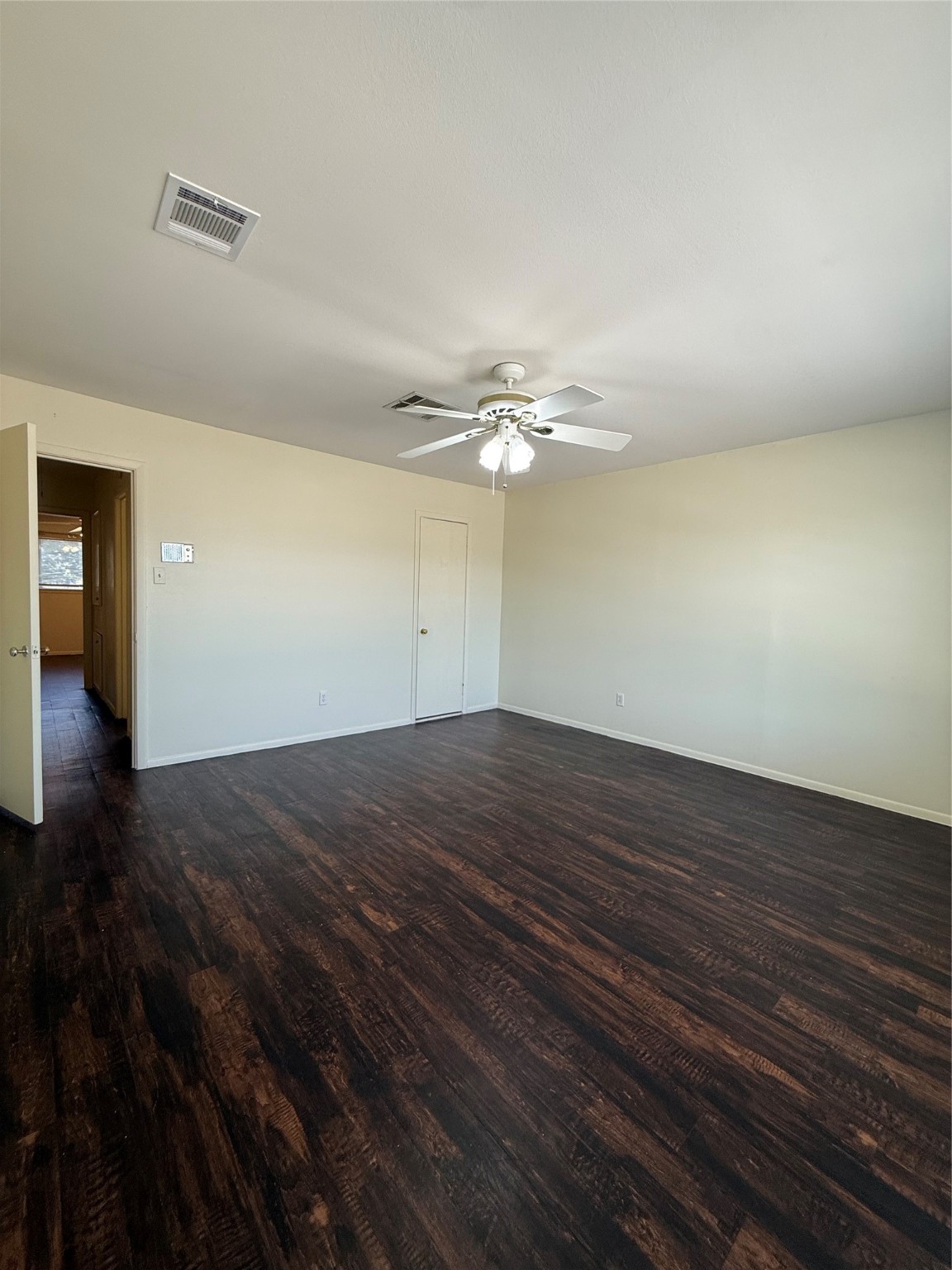 8140 Fondren Road, Unit 8140 Houston, TX 77074 - Photo 24 of 28 a view of a room with wooden floor and ceiling fan