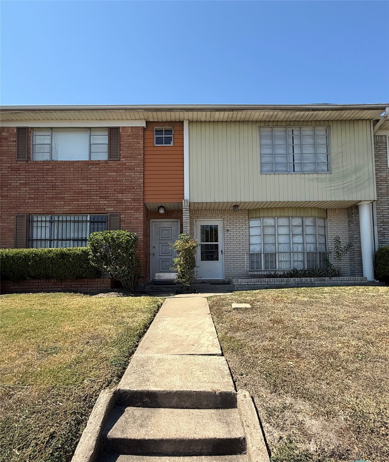 8140 Fondren Road, Unit 8140 Houston, TX 77074 - Photo 25 of 28 a front view of a house with yard