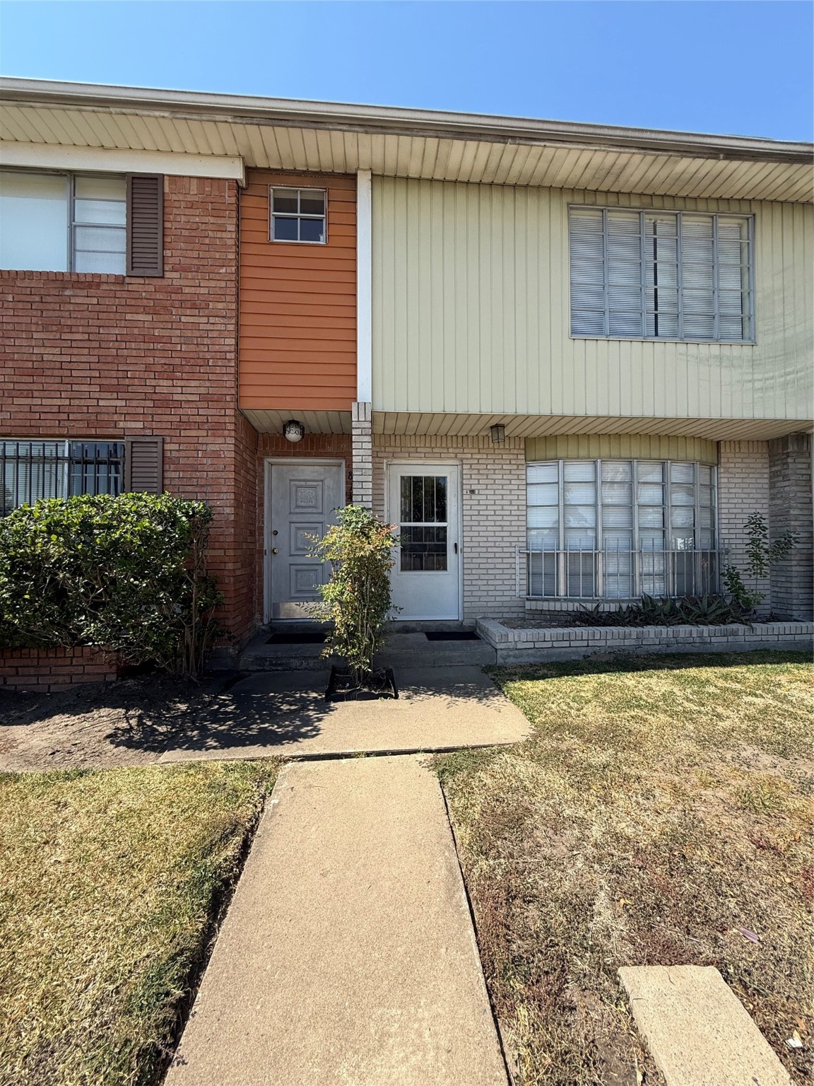 8140 Fondren Road, Unit 8140 Houston, TX 77074 - Photo 27 of 28 a front view of a house with a yard