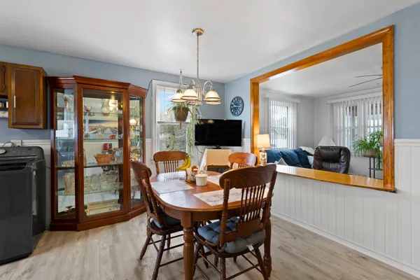 a view of a house with a yard and sitting area