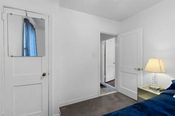 a view of a dining room with furniture a chandelier and wooden floor