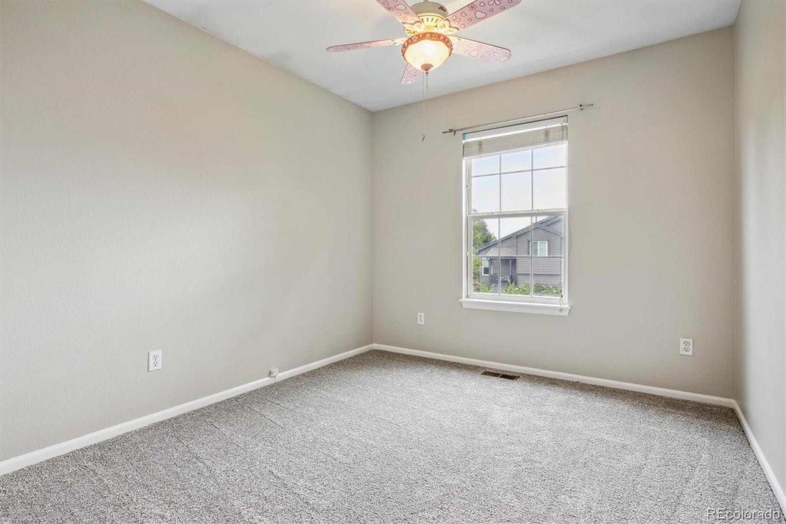 9773 Saybrook Street Highlands Ranch, CO 80126 - Photo 15 of 21 an empty room with a window