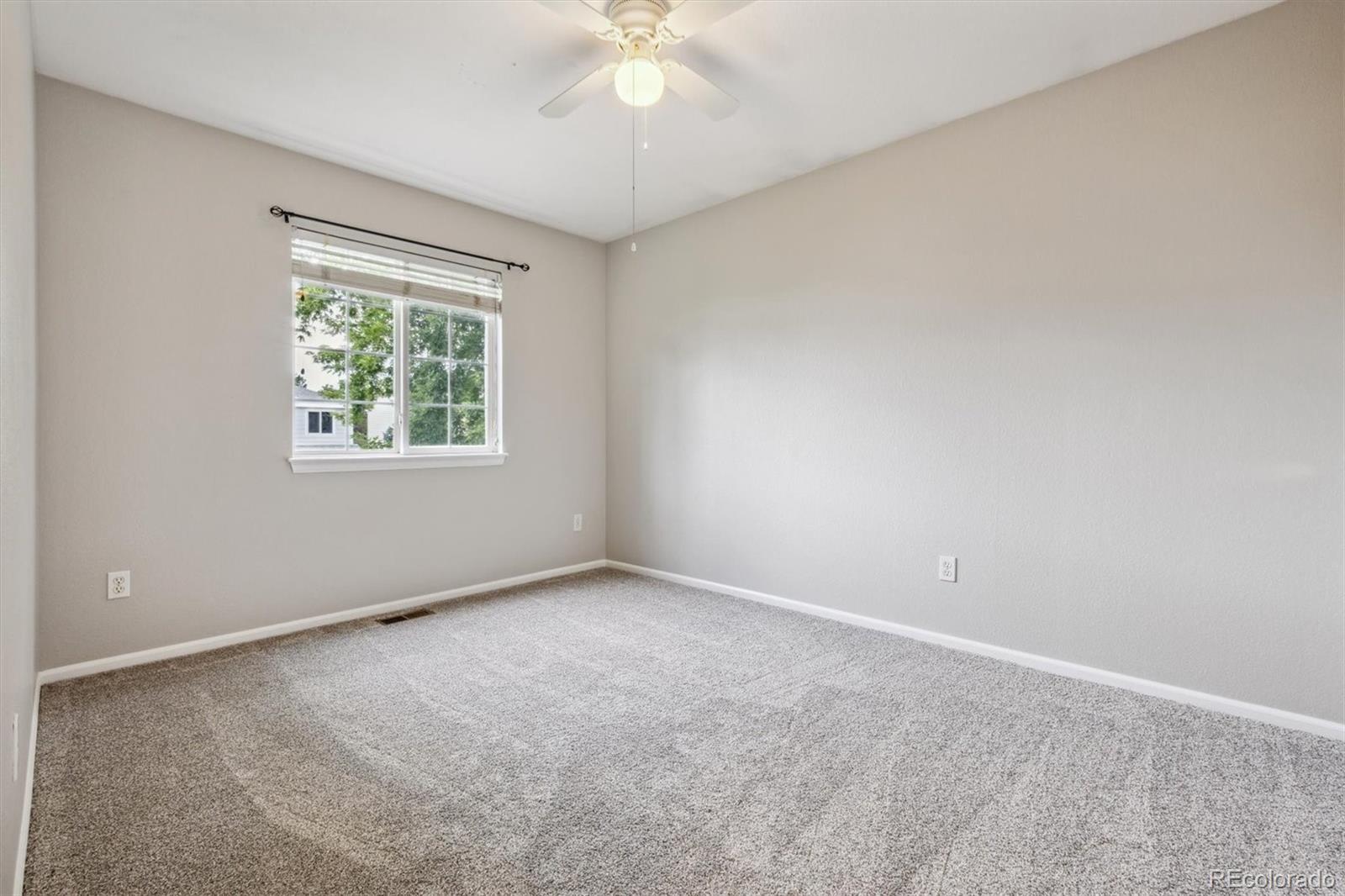 9773 Saybrook Street Highlands Ranch, CO 80126 - Photo 16 of 21 an empty room with a window