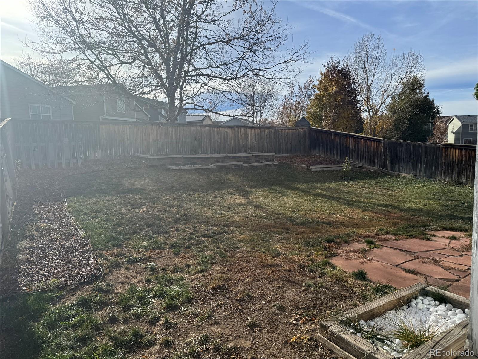 9773 Saybrook Street Highlands Ranch, CO 80126 - Photo 19 of 21 a backyard of a house