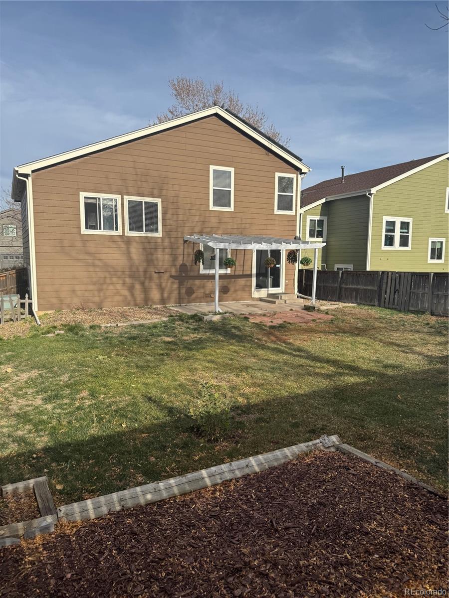 9773 Saybrook Street Highlands Ranch, CO 80126 - Photo 21 of 21 a front view of a house with a yard