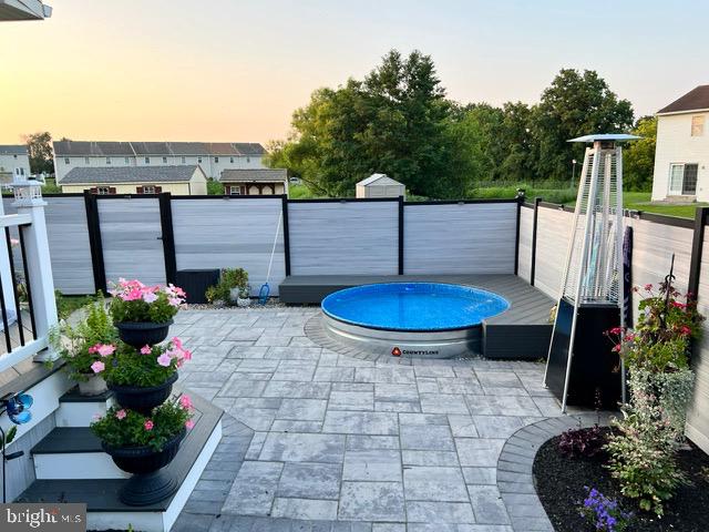 247 Bainbridge Circle Reading, PA 19608 - Photo 24 of 30 a view of a backyard with plants and a water fountain